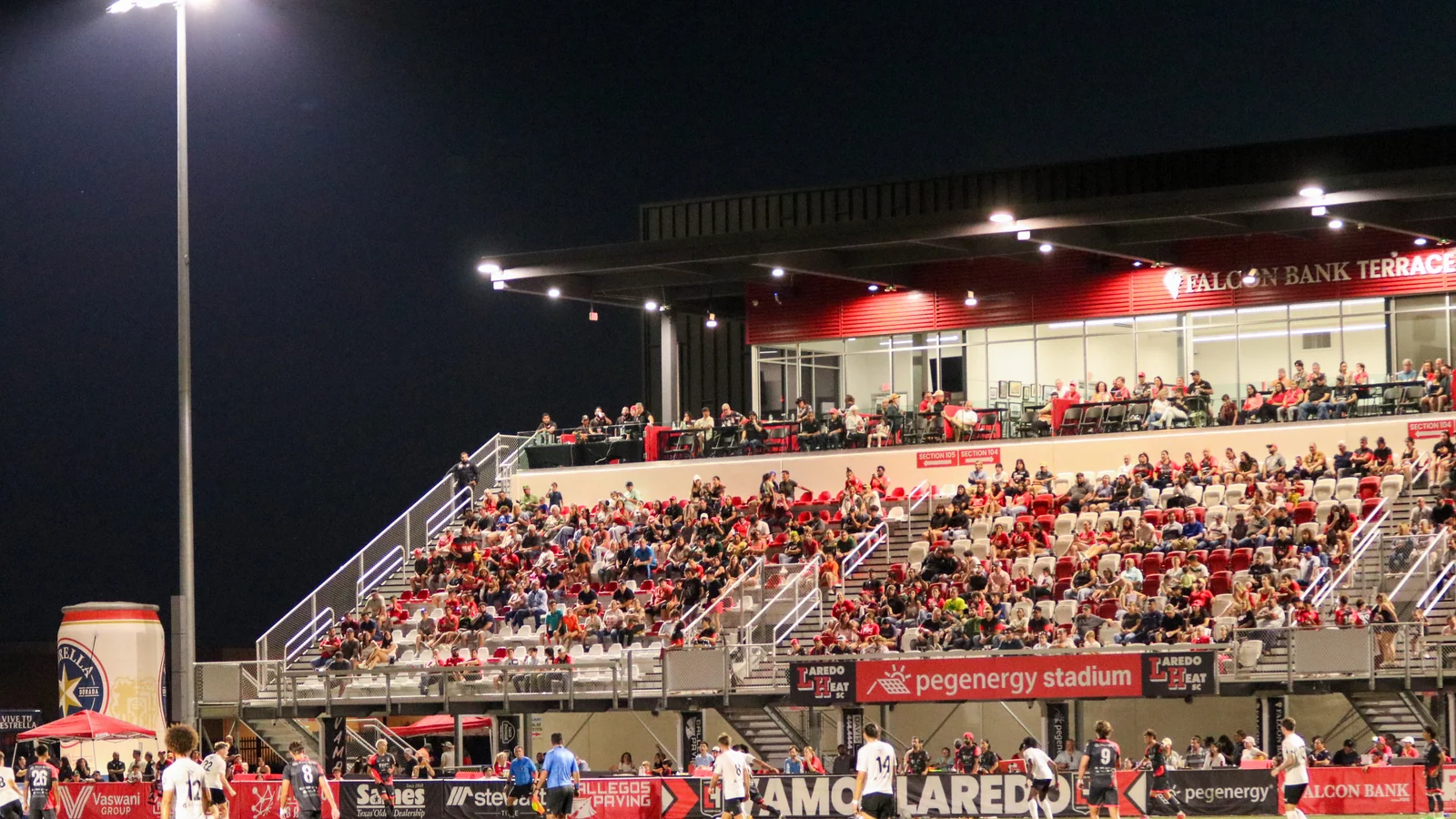 Supporters and players at a Laredo Heat match at PEG Energy Stadium